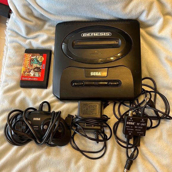 SEGA GENESIS. SEGA GENESIS GAME CONSOLE. ONE CONTROLLER. ADAPTERS. ONE GAME
